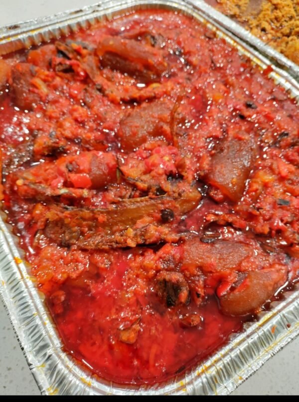 Ata dindin (palmoil sauce with ponmo and eja kika)